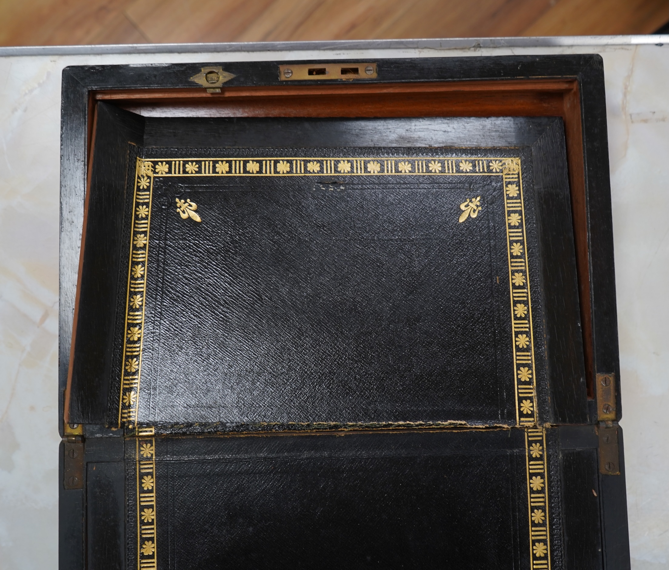 A brass bound walnut writing box with tooled leather slope, 35cm wide